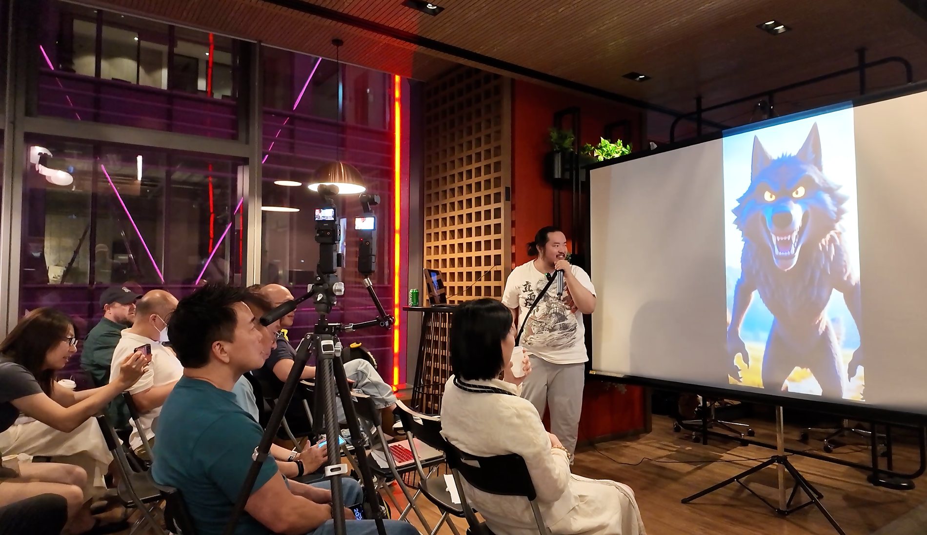 Speaker presenting an AI-generated wolf video on the projector screen